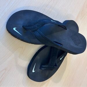 Nike Black Flip Flops with White Swoosh Accent W6